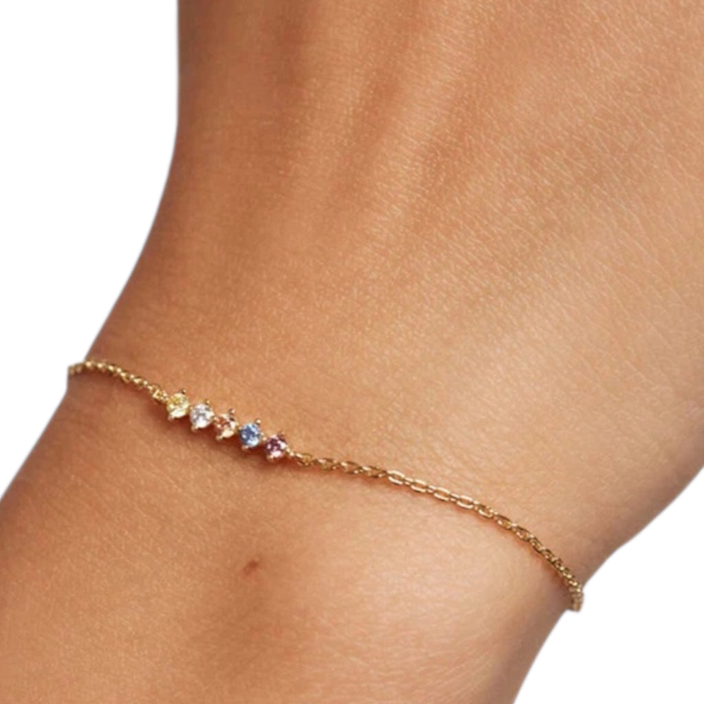 Hand wearing the Dainty Multicolor Zircon Bracelet – 925 Sterling Silver